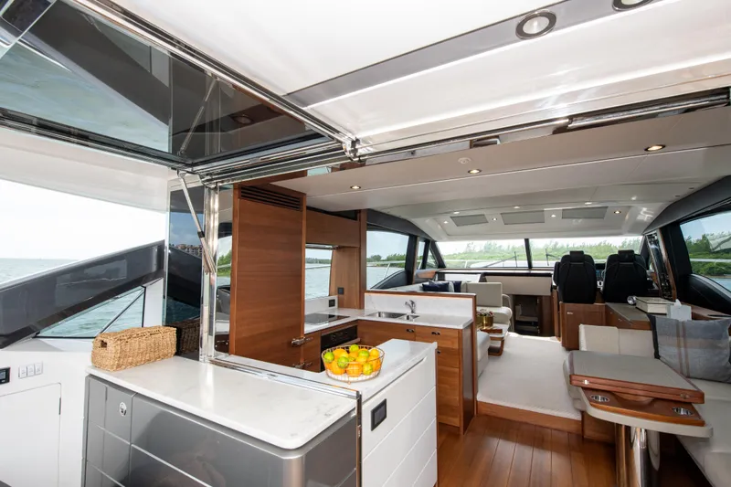 Slide: The Image of Luxurious interior of 2021 Princess S66 yacht with modern kitchen and seating area. - 17