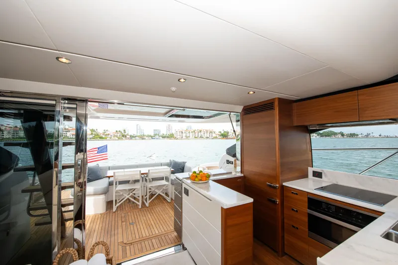 Slide: The Image of Luxurious 2021 Princess S66 yacht interior with modern kitchen and scenic ocean view. - 18