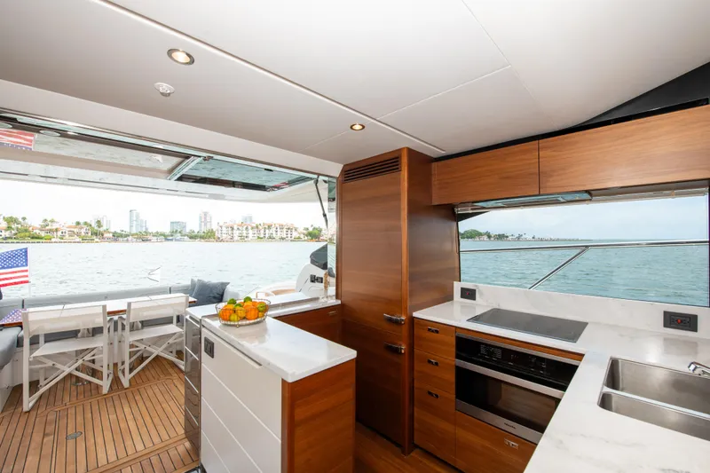 Slide: The Image of Luxurious 2021 Princess S66 yacht interior with modern kitchen and scenic ocean view. - 19
