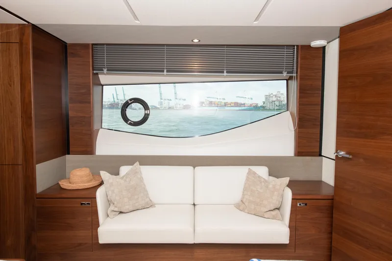 Slide: The Image of Luxurious interior of 2021 Princess S66 yacht with white sofa and scenic window view. - 29
