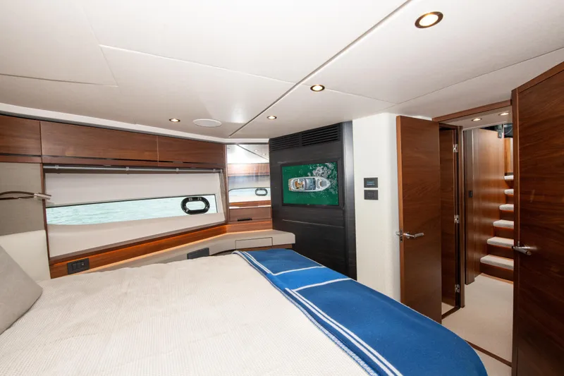 Slide: The Image of Luxurious bedroom interior of 2021 Princess S66 yacht with modern design and elegant wood finishes. - 32
