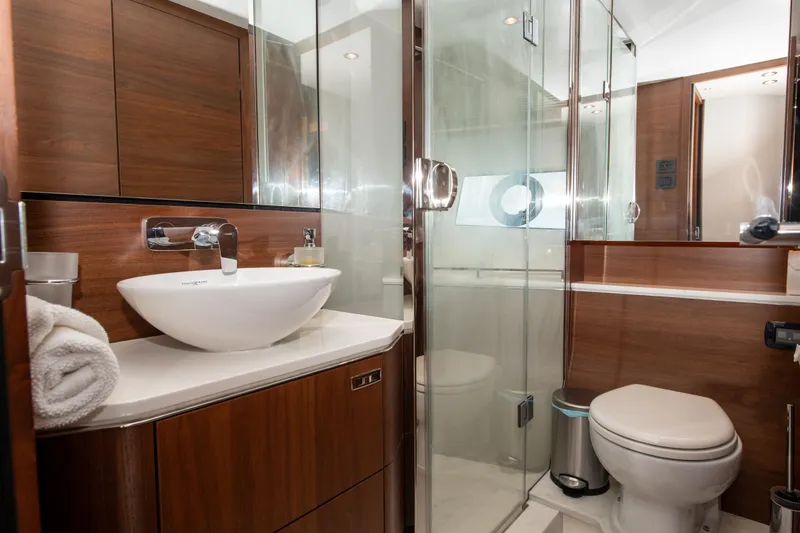 Slide: The Image of Luxurious bathroom in 2021 Princess S66 yacht with modern fixtures and wooden cabinetry. - 33
