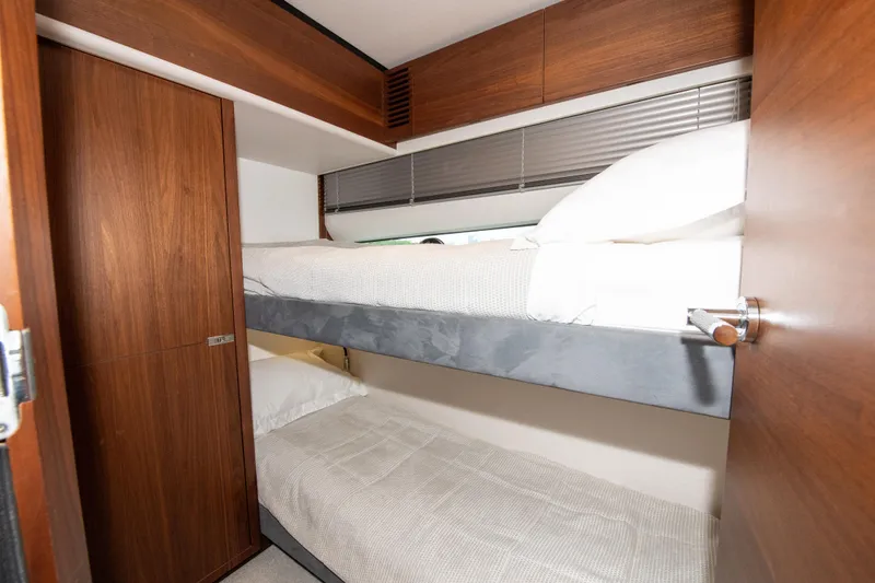 Slide: The Image of Bunk beds in 2021 Princess S66 yacht cabin with wooden interior. - 34