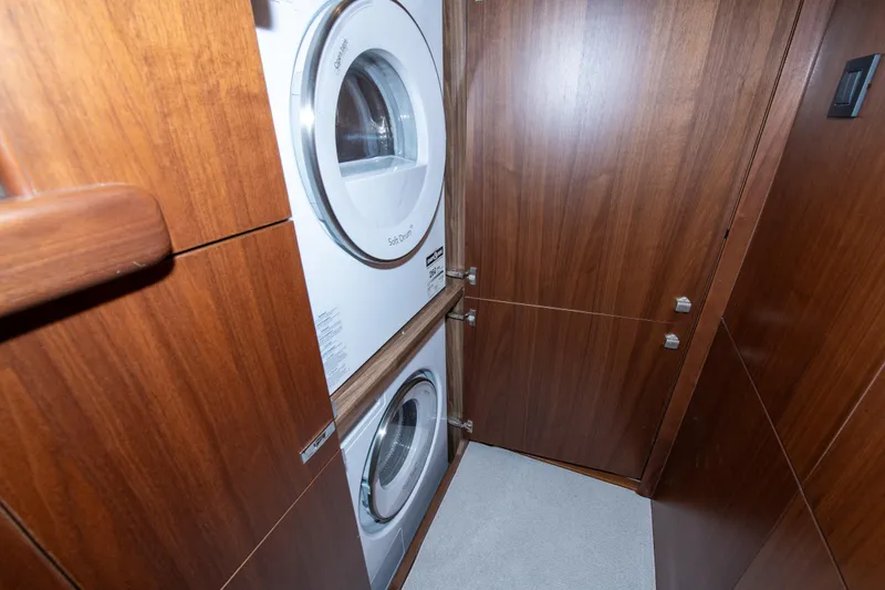Slide: The Image of Laundry area with stacked washer and dryer in 2021 Princess S66 yacht. - 36
