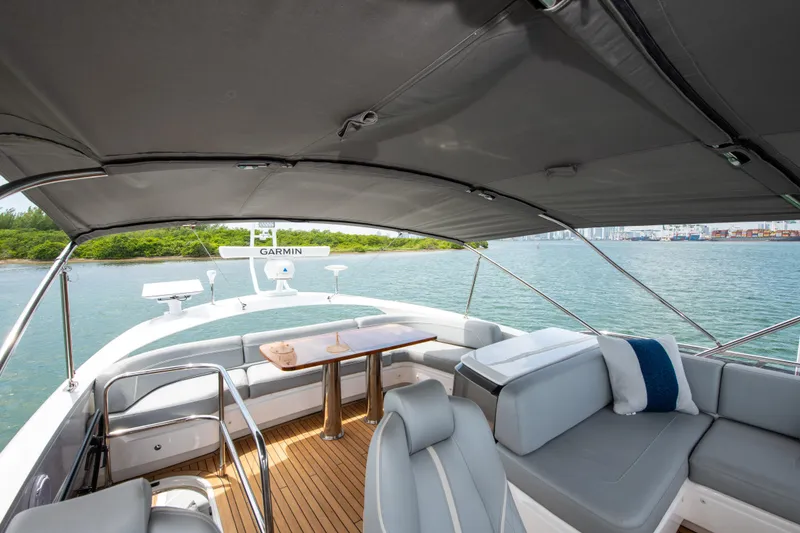 Slide: The Image of Luxurious 2021 Princess S66 yacht interior with elegant seating and scenic water view. - 39