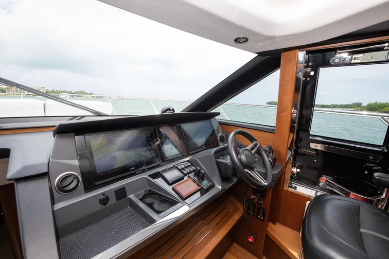 Slide: The Image of Helm of 2021 Princess S66 yacht with modern controls and steering wheel. - 5