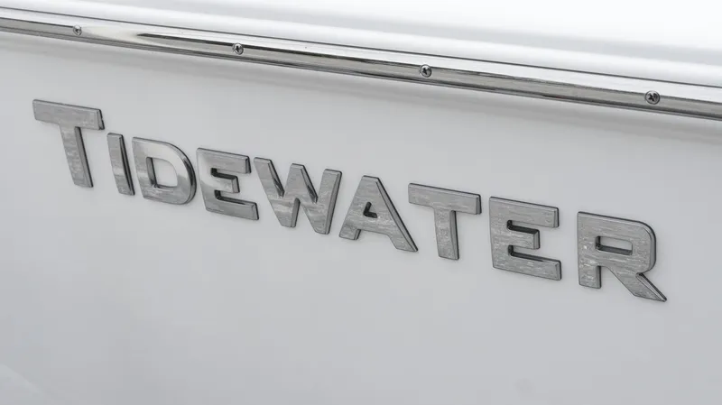Slide: The Image of Tidewater 1910 Bay Max 2025 boat logo on white surface. - 13