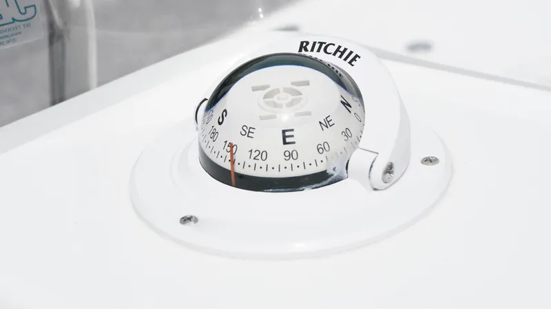 Slide: The Image of Compass on 2025 Tidewater 1910 Bay Max boat dashboard. - 18