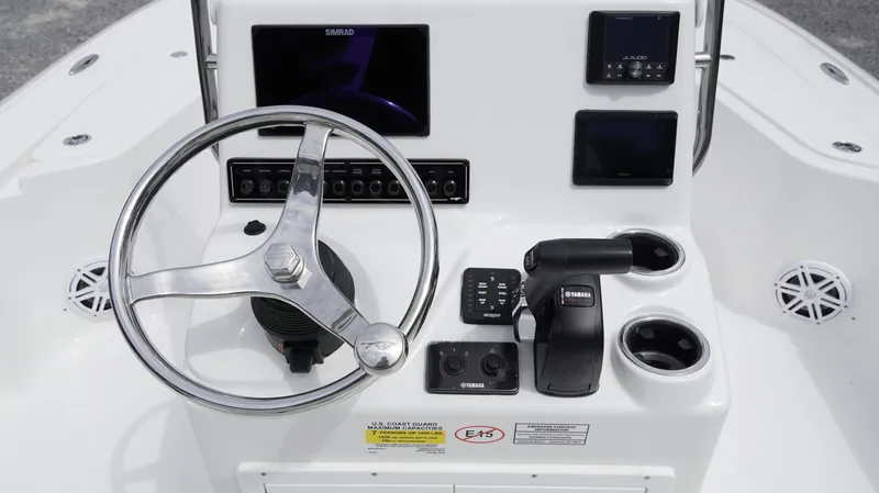 Slide: The Image of Steering console of 2025 Tidewater 1910 Bay Max boat with modern controls and displays. - 21
