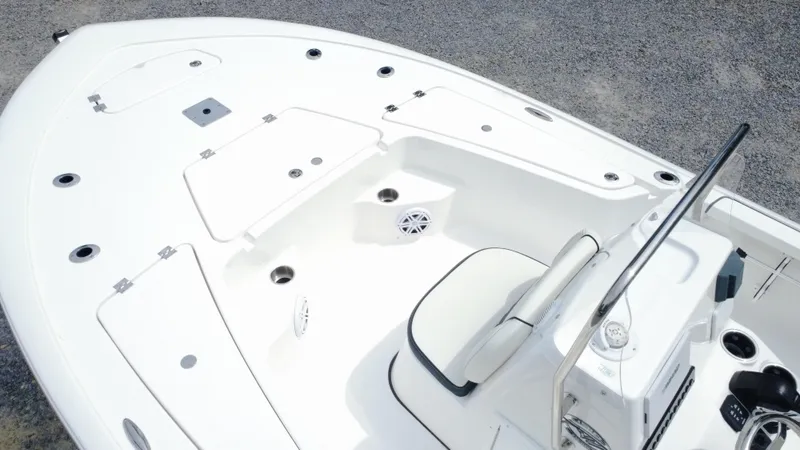 Slide: The Image of 2025 Tidewater 1910 Bay Max boat interior with seating and storage compartments. - 6