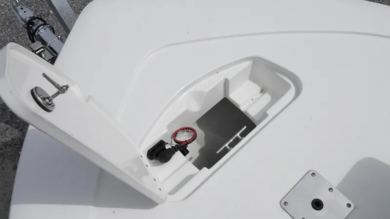 Slide: The Image of 2025 Tidewater 1910 Bay Max boat compartment with open hatch and gauge. - 8