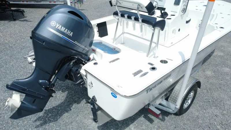 Slide: The Image of 2025 Tidewater 1910 Bay Max boat with Yamaha outboard motor on a trailer. - 9