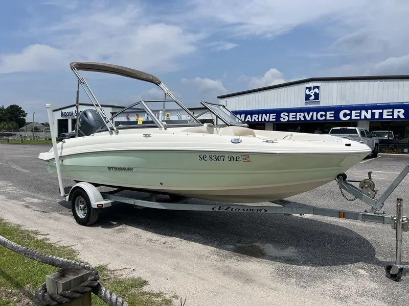 Slide: The Image of 2019 Stingray 191DC (OB) boat on trailer at marine service center. - 7