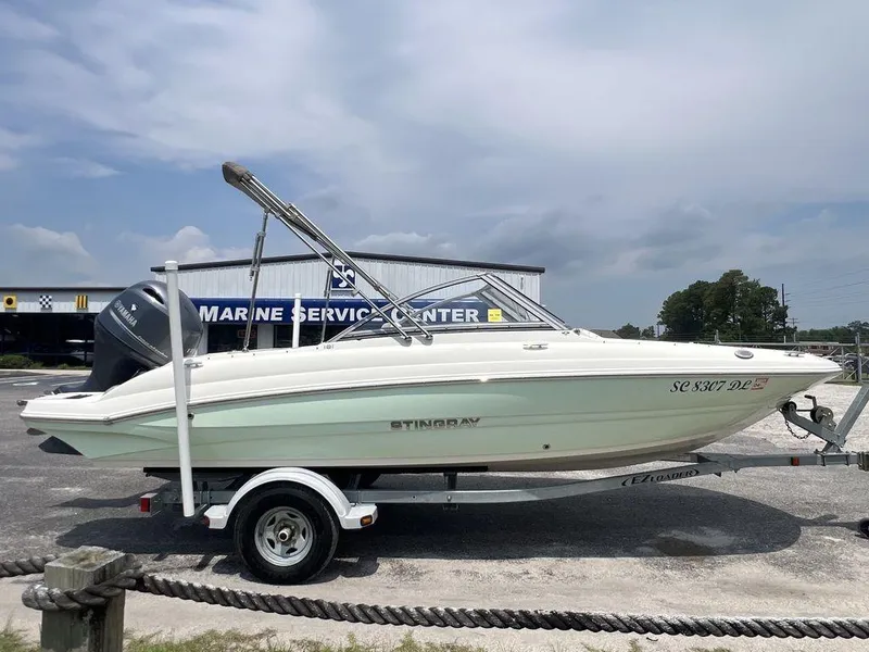 Slide: The Image of 2019 Stingray 191DC (OB) boat on trailer at marine service center. - 8