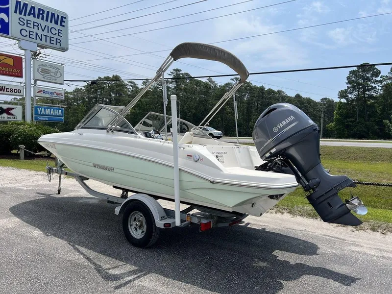 Slide: The Image of 2019 Stingray 191DC (OB) boat on trailer at marine service center. - 9