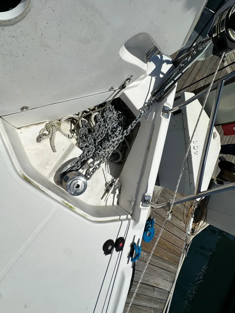 Slide: The Image of Anchor chain and winch on 2013 Hunter 33 sailboat deck. - 12