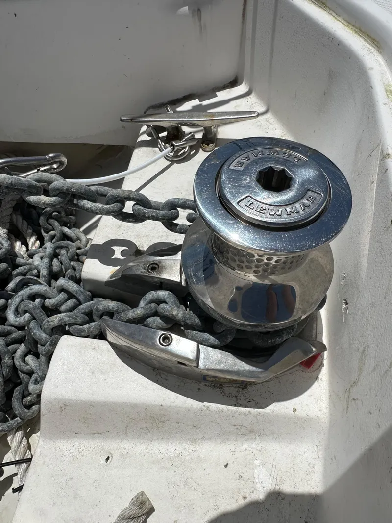 Slide: The Image of Anchor windlass on 2013 Hunter 33 sailboat deck with chain. - 13