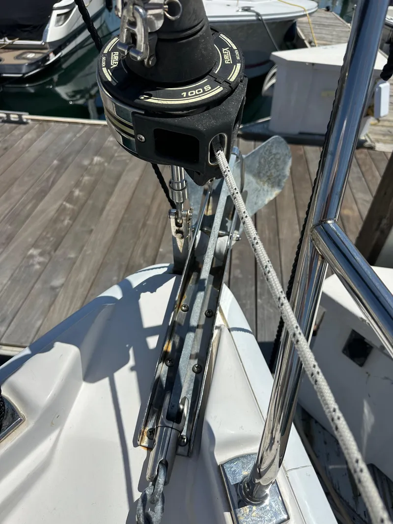 Slide: The Image of Close-up of a 2013 Hunter 33 sailboat's deck and rigging at a marina. - 14