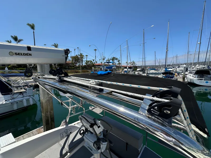 Slide: The Image of Hunter 33 sailboat, 2013 model, docked in a marina with clear blue skies. - 19