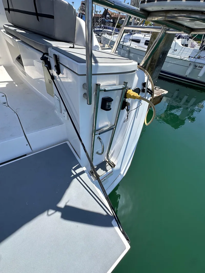 Slide: The Image of Hunter 33 sailboat stern with ladder and dock connection, 2013 model. - 24