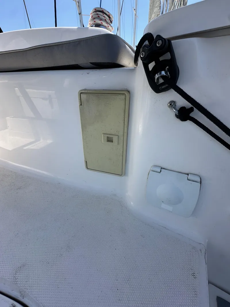 Slide: The Image of 2013 Hunter 33 sailboat deck with control panel and fittings. - 26
