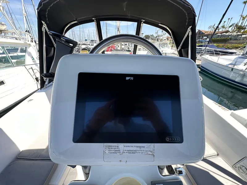 Slide: The Image of Cockpit of 2013 Hunter 33 sailboat with navigation display at marina. - 28