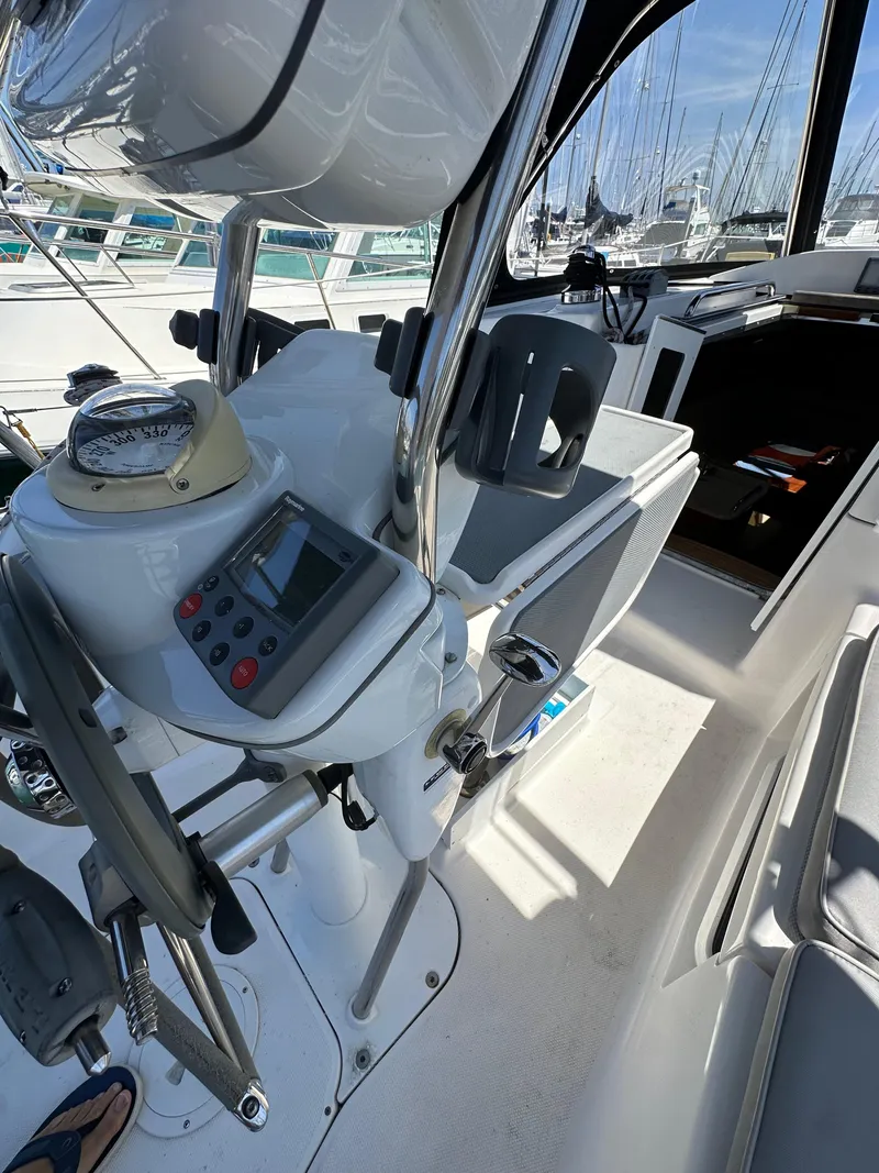 Slide: The Image of Cockpit of 2013 Hunter 33 sailboat with navigation equipment and steering wheel. - 29