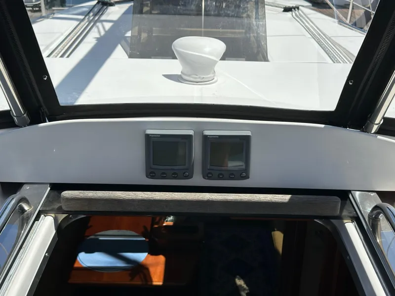 Slide: The Image of Cockpit view of 2013 Hunter 33 sailboat with navigation instruments and hatch. - 31