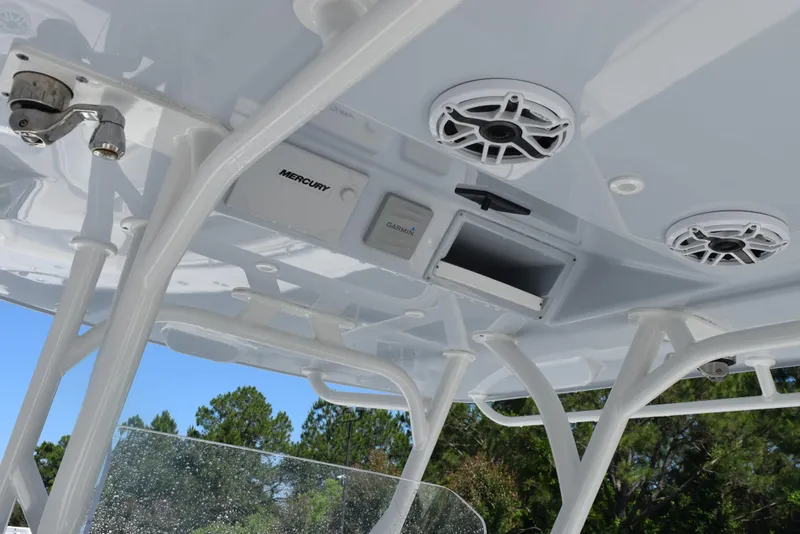 Slide: The Image of 2022 Yellowfin 34 Offshore boat interior with speakers and storage compartment. - 11