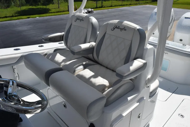 Slide: The Image of 2022 Yellowfin 34 Offshore boat seats with embroidered logo, featuring diamond-pattern upholstery. - 14