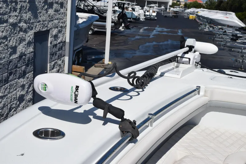 Slide: The Image of 2022 Yellowfin 34 Offshore boat with advanced trolling motor in a marina setting. - 17