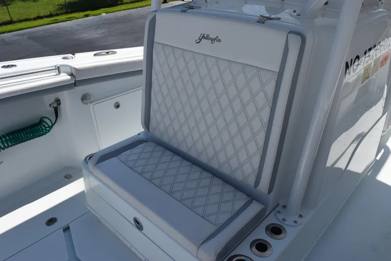 Slide: The Image of 2022 Yellowfin 34 Offshore boat seat with diamond-pattern upholstery. - 19