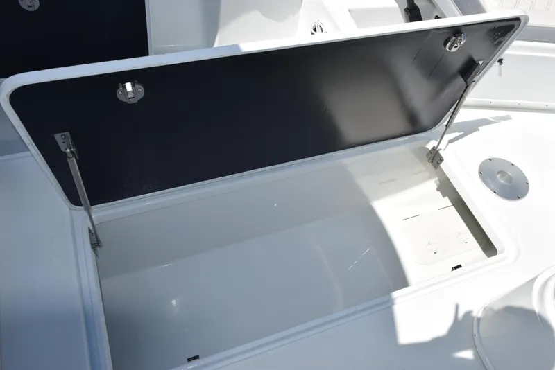 Slide: The Image of Open storage compartment on 2022 Yellowfin 34 Offshore boat. - 22