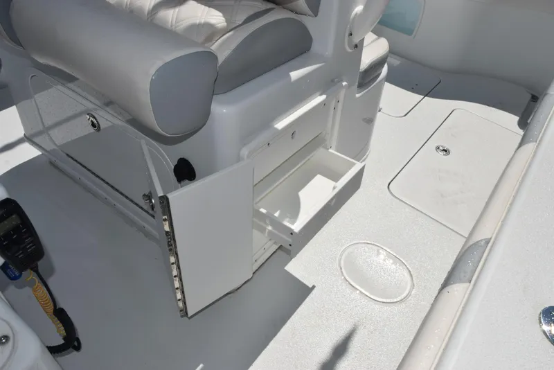 Slide: The Image of 2022 Yellowfin 34 Offshore boat interior with open storage compartments and seating. - 29