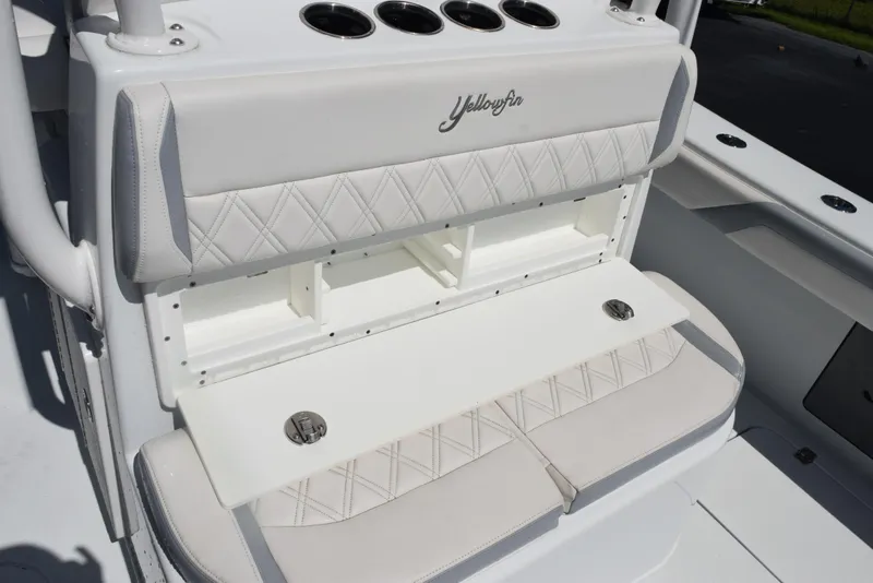 Slide: The Image of 2022 Yellowfin 34 Offshore boat seating with storage and cup holders. - 30