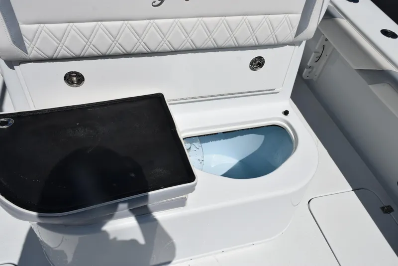 Slide: The Image of 2022 Yellowfin 34 Offshore boat interior with open storage compartment. - 31