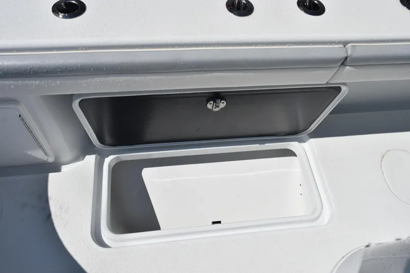 Slide: The Image of 2022 Yellowfin 34 Offshore boat storage compartment with open lid. - 32