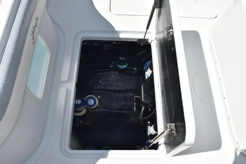 Slide: The Image of 2022 Yellowfin 34 Offshore boat storage compartment with open hatch. - 33