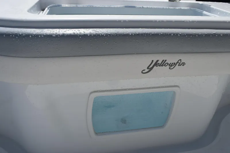 Slide: The Image of 2022 Yellowfin 34 Offshore boat detail with logo and water droplets. - 35