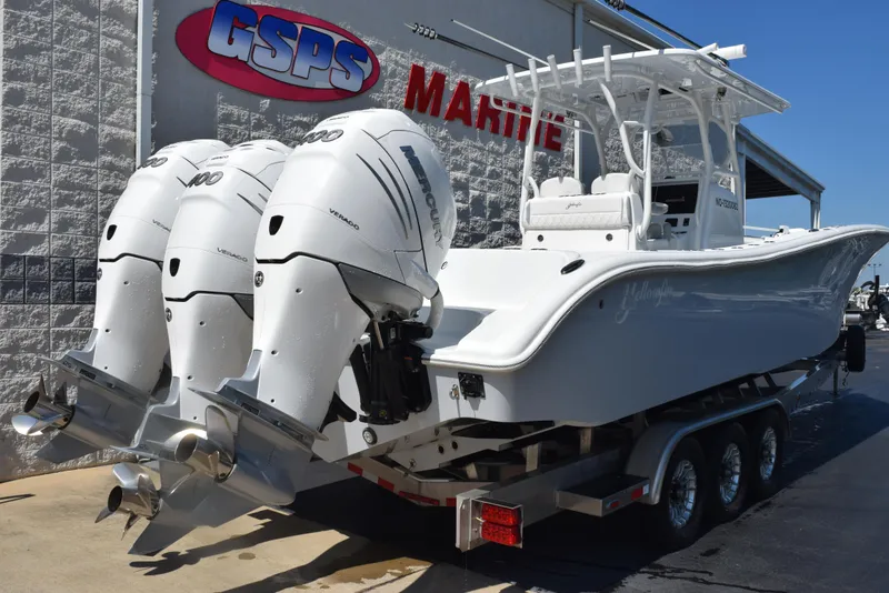 Slide: The Image of 2022 Yellowfin 34 Offshore boat with triple engines on a trailer at GSPS Marine. - 4