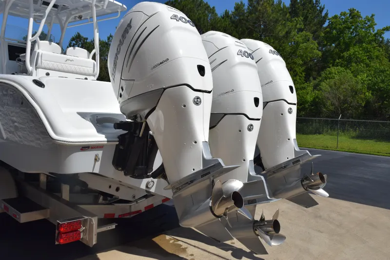 Slide: The Image of 2022 Yellowfin 34 Offshore boat with triple outboard engines. - 7