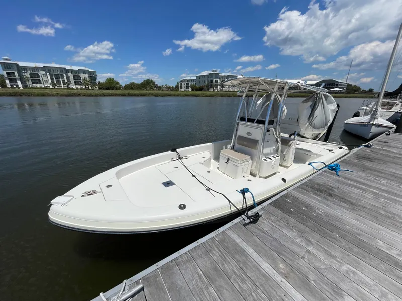 The Image of 2012 Ranger 2410 Bay Ranger boat docked on a sunny day. - 0