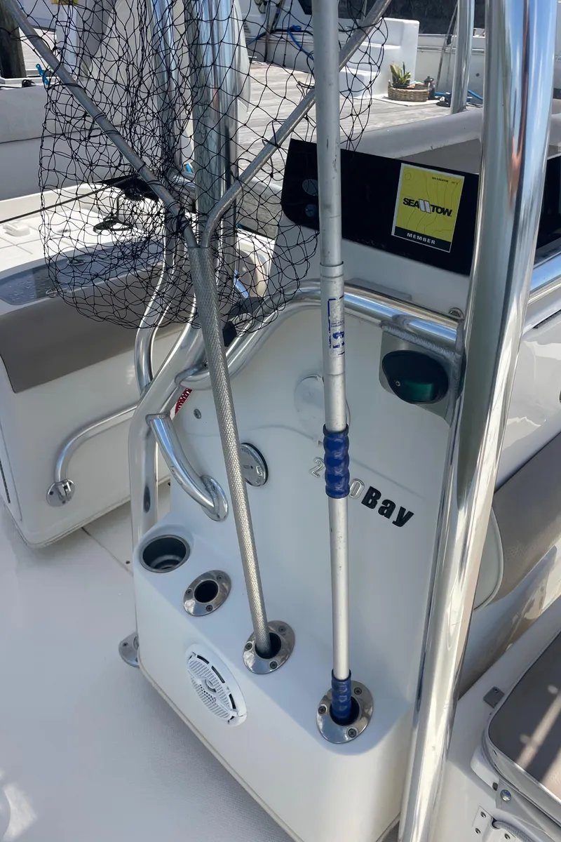 Slide: The Image of 2012 Ranger 2410 Bay Ranger boat with fishing gear and rod holders. - 10