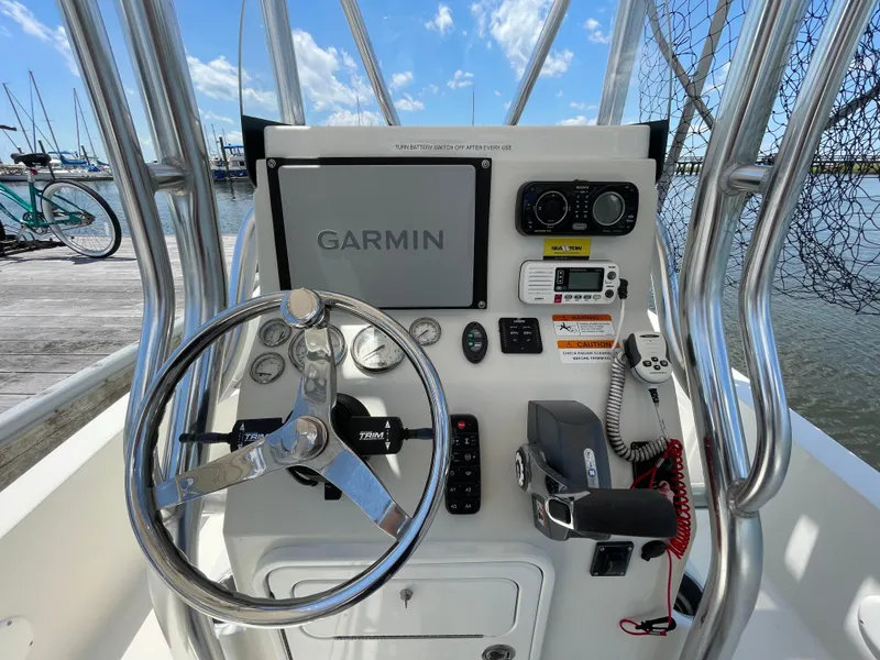 Slide: The Image of 2012 Ranger 2410 Bay Ranger boat console with Garmin navigation system and steering wheel. - 4