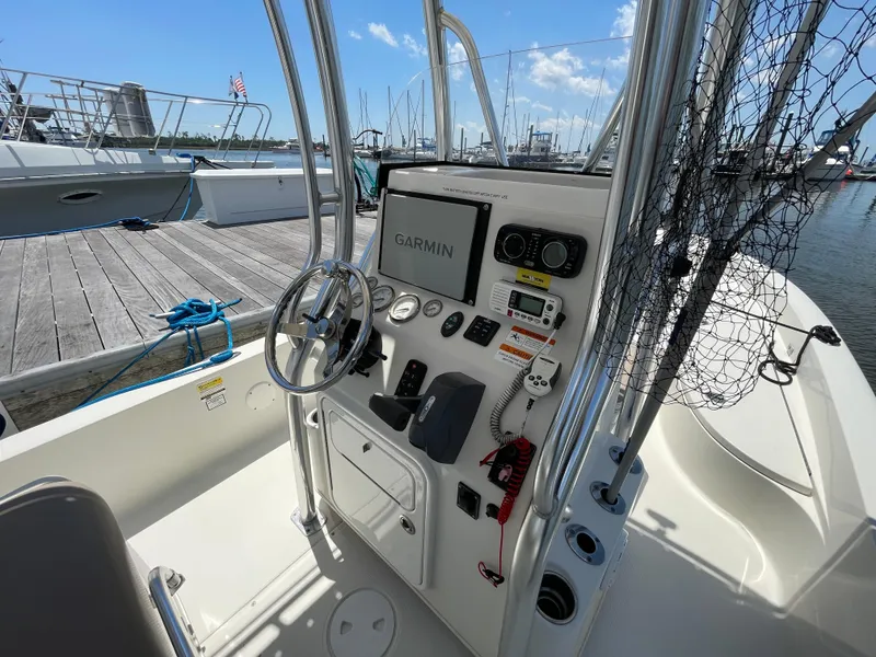 Slide: The Image of 2012 Ranger 2410 Bay Ranger boat console with Garmin navigation, docked at marina. - 5
