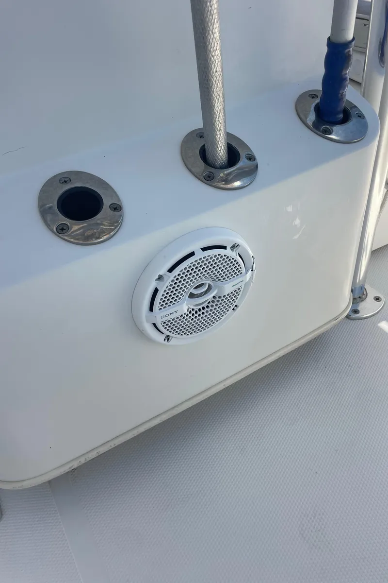 Slide: The Image of 2012 Ranger 2410 Bay Ranger boat deck with speaker and rod holders. - 8