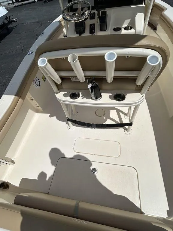 Slide: The Image of 2021 Scout 215 XSF boat interior with rod holders and steering console. - 10