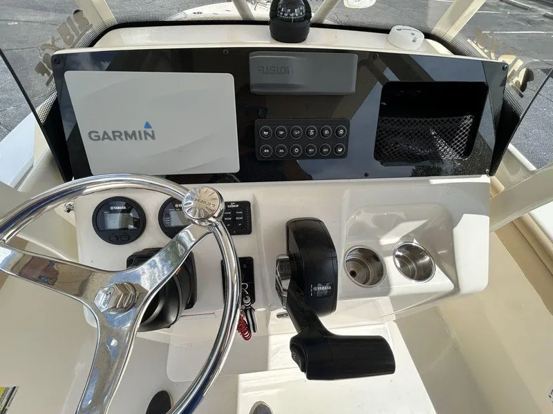 Slide: The Image of 2021 Scout 215 XSF boat dashboard with Garmin navigation system and steering wheel. - 6