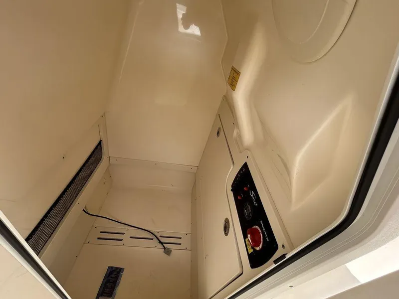 Slide: The Image of Interior view of 2021 Scout 215 XSF boat compartment with control panel. - 9