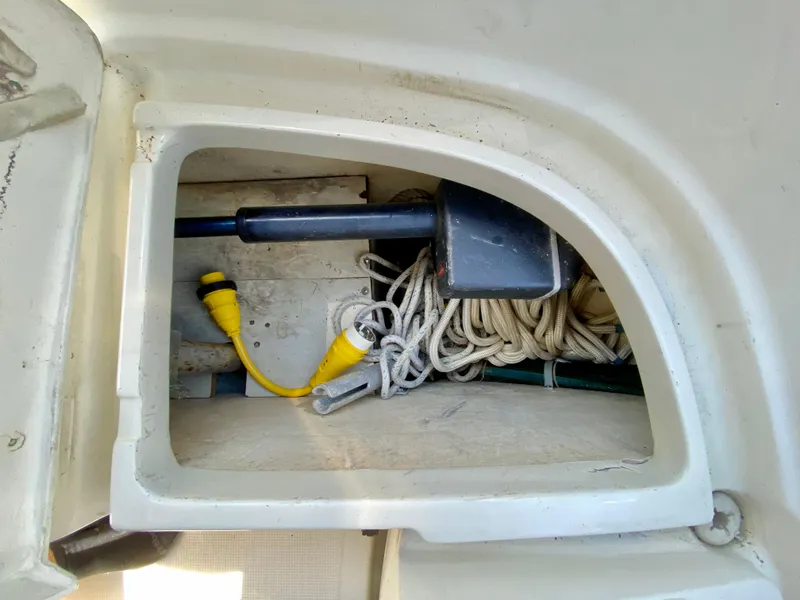Slide: The Image of Compartment on 1998 Pacific Seacraft 37 with rope and yellow electrical cable. - 11